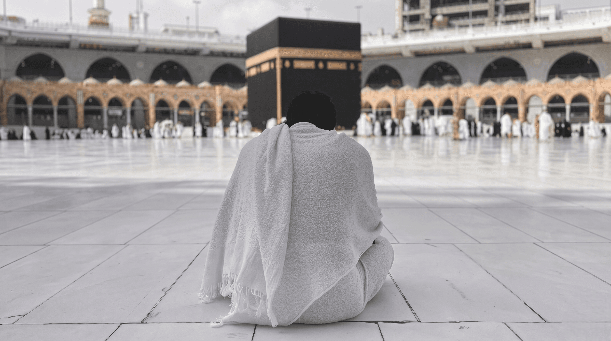 Pilgrim facing the Kaaba at Masjid al-Haram